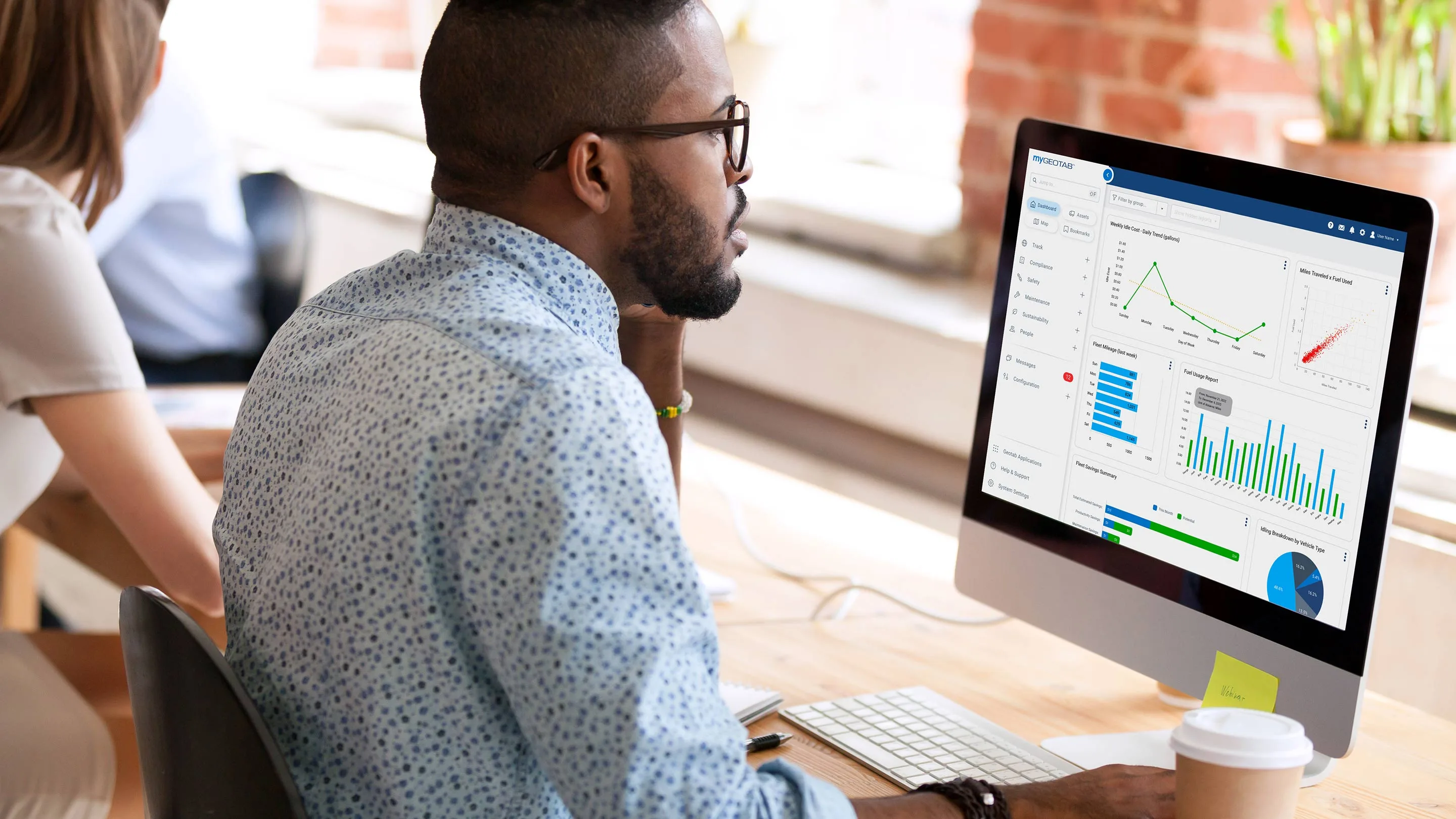 Fleet operator interacting with Geotab's vehicle tracking dashboard